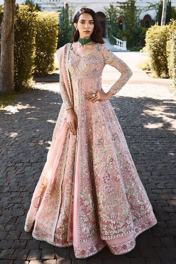 Model wearing pastel pink Florencea dress from Soraya, detailed with intricate golden embroidery, ideal for Pakistani wedding clothes in UK.