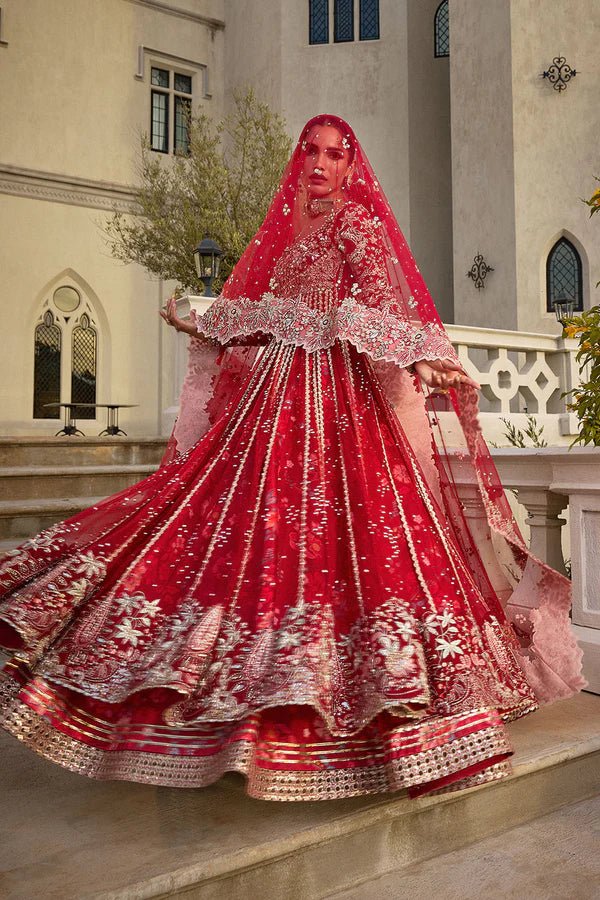 Model wearing vibrant red MARYBELLÉ dress from Soraya, embellished with white and gold embroidery, perfect for Pakistani wedding and nikkah look in UK