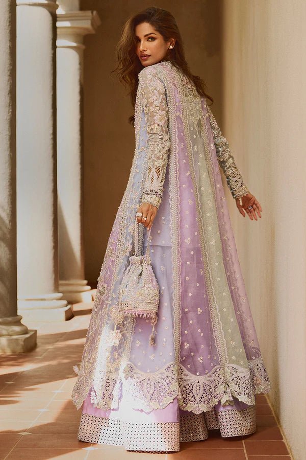 Model wearing pastel lilac ORCHID dress from Soraya, adorned with intricate embroidery and embellishments, perfect for Pakistani wedding clothes in the UK.