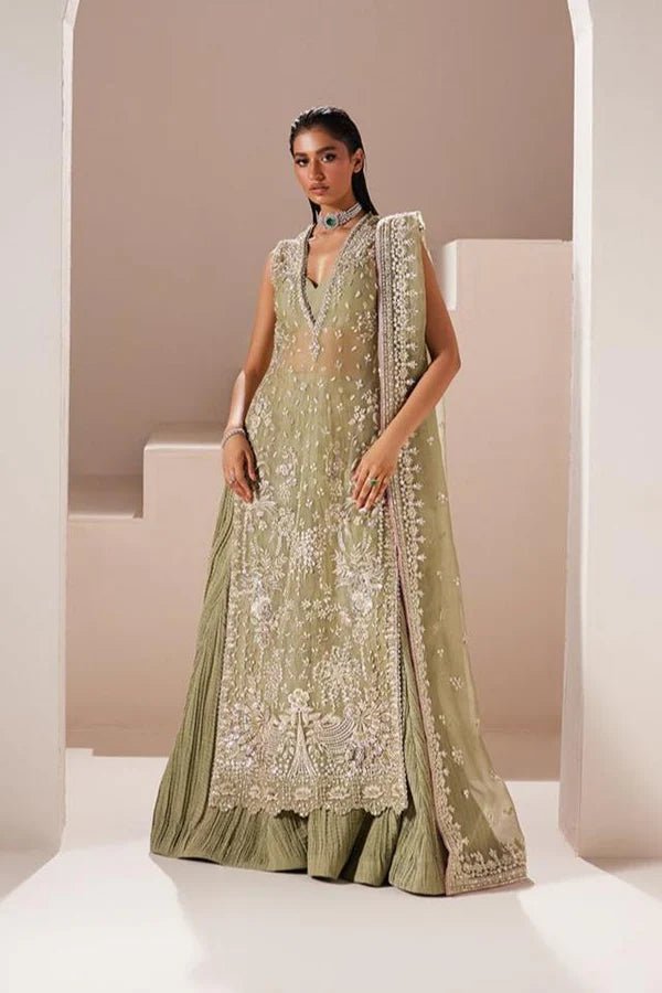 Model wearing Soraya Celeste dress in sage green from the Oriana Luxury Formals collection, ideal for weddings, available for Pakistani clothes online in the UK.