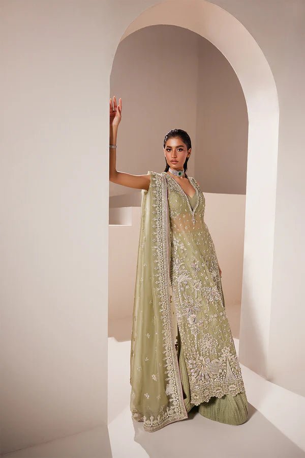 Model wearing Soraya Celeste dress in sage green from the Oriana Luxury Formals collection, ideal for weddings, available for Pakistani clothes online in the UK.