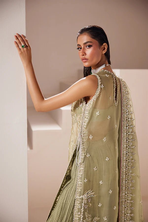 Model wearing Soraya Celeste dress in sage green from the Oriana Luxury Formals collection, ideal for weddings, available for Pakistani clothes online in the UK.