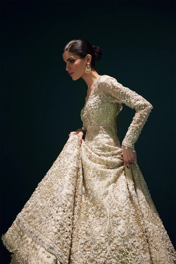 Model wearing Soraya Elysian dress in champagne from the Oriana Luxury Formals collection, perfect for weddings, available for Pakistani clothes online in the UK.