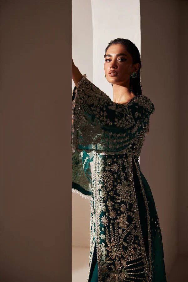 Model wearing Soraya Luxe dress in deep green from the Oriana Luxury Formals collection, ideal for weddings, available for Pakistani clothes online in the UK.