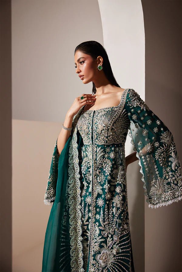 Model wearing Soraya Luxe dress in deep green from the Oriana Luxury Formals collection, ideal for weddings, available for Pakistani clothes online in the UK.