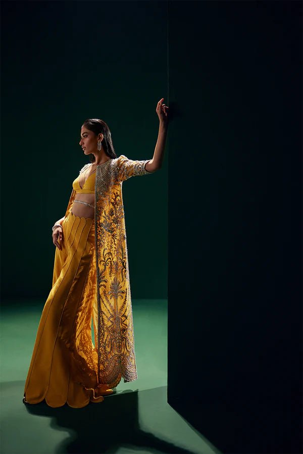 Model wearing Soraya Oriana Luxury Formals Monarch dress in yellow, showcasing intricate embroidery, ideal for Pakistani clothes online in the UK, perfect for wedding occasions.