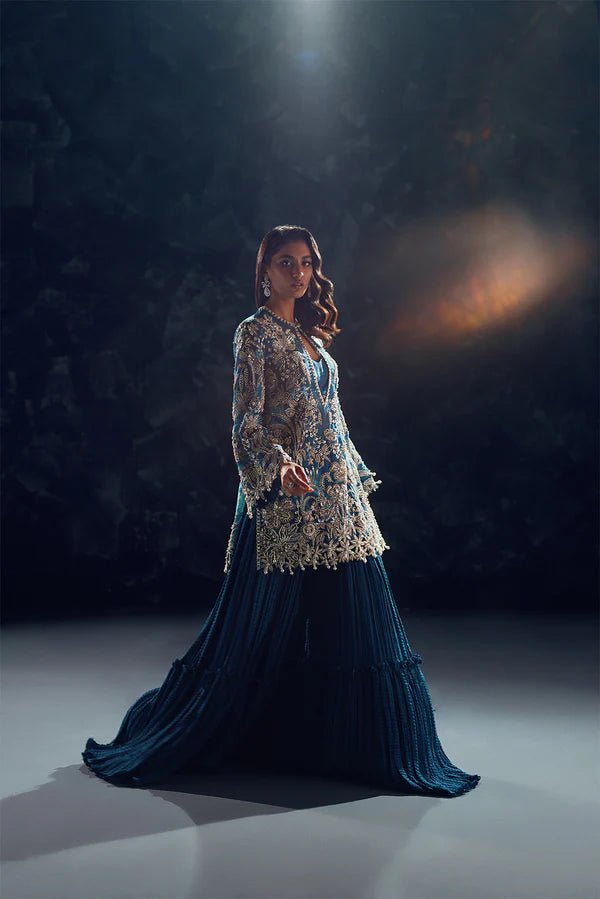 Model wearing Soraya Oriana Luxury Formals Serenity dress in teal, featuring intricate embroidery, ideal for Pakistani wedding clothes online in the UK.