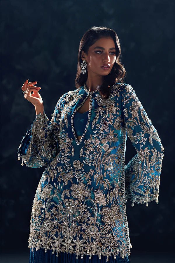 Model wearing Soraya Oriana Luxury Formals Serenity dress in teal, featuring intricate embroidery, ideal for Pakistani wedding clothes online in the UK.