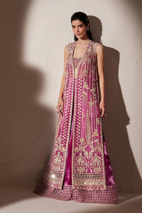 Model wearing Soraya Oriana Luxury Formals Verdant dress in magenta, featuring intricate embellishments, perfect for Pakistani wedding clothes online in the UK.