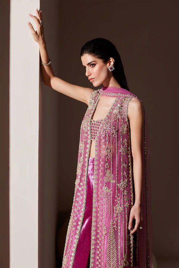 Model wearing Soraya Oriana Luxury Formals Verdant dress in magenta, featuring intricate embellishments, perfect for Pakistani wedding clothes online in the UK.