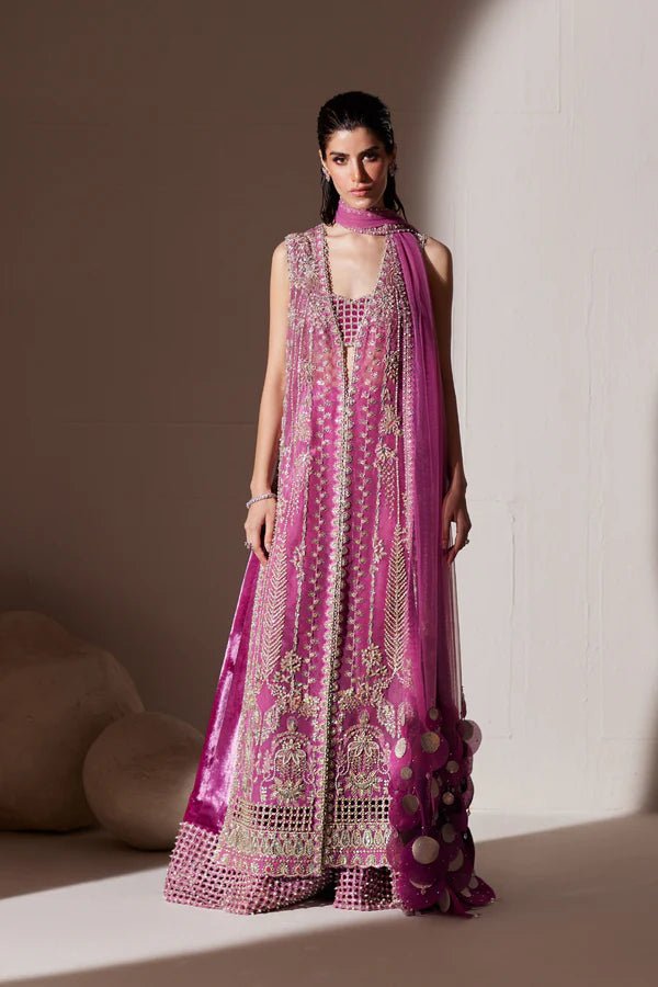 Model wearing Soraya Oriana Luxury Formals Verdant dress in magenta, featuring intricate embellishments, perfect for Pakistani wedding clothes online in the UK.