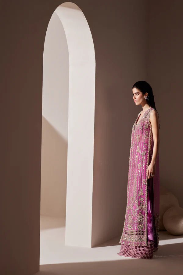 Model wearing Soraya Oriana Luxury Formals Verdant dress in magenta, featuring intricate embellishments, perfect for Pakistani wedding clothes online in the UK.