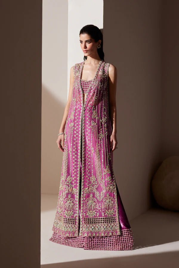 Model wearing Soraya Oriana Luxury Formals Verdant dress in magenta, featuring intricate embellishments, perfect for Pakistani wedding clothes online in the UK.