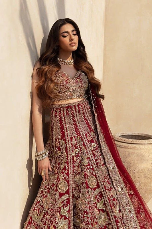 Model wearing SARANG - BRIDALS AND FORMAL '23 IXORA, an equisite mold by SORAYA UK, Pakistani Clothes UK.