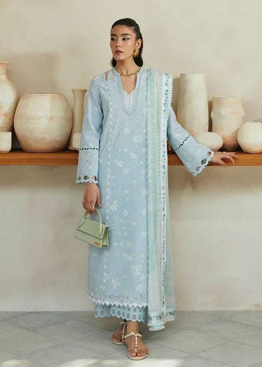 Model wearing Suffuse Luna dress in light blue with floral embroidery, perfect for Pakistani designer clothes in the UK.