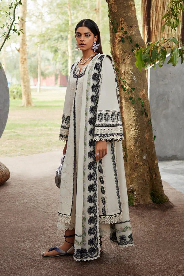 Model showcasing Suffuse Afsaneh dress, a trendy option for Pakistani clothes online in UK. Perfect blend of style and tradition.