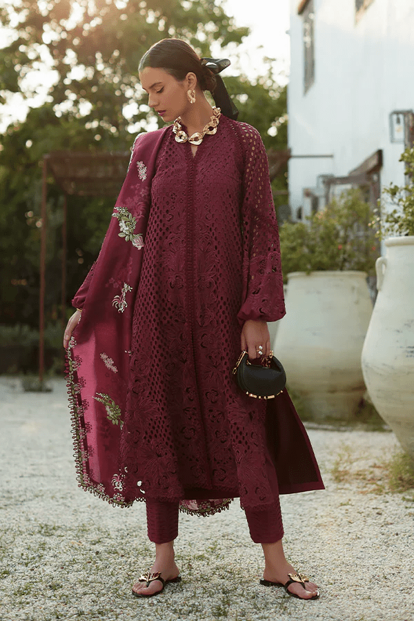 Model wearing a maroon Milan dress from Suffuse's Casual Pret collection, featuring intricate floral embroidery. Perfect for Pakistani clothes online in the UK.