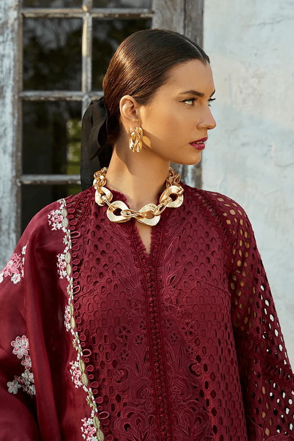 Model wearing a maroon Milan dress from Suffuse's Casual Pret collection, featuring intricate floral embroidery. Perfect for Pakistani clothes online in the UK.