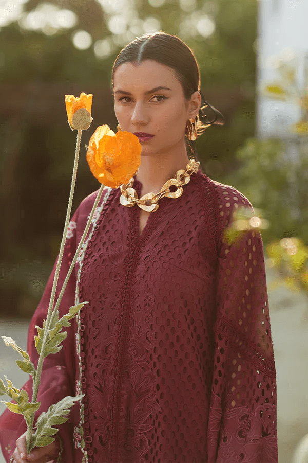 Model wearing a maroon Milan dress from Suffuse's Casual Pret collection, featuring intricate floral embroidery. Perfect for Pakistani clothes online in the UK.