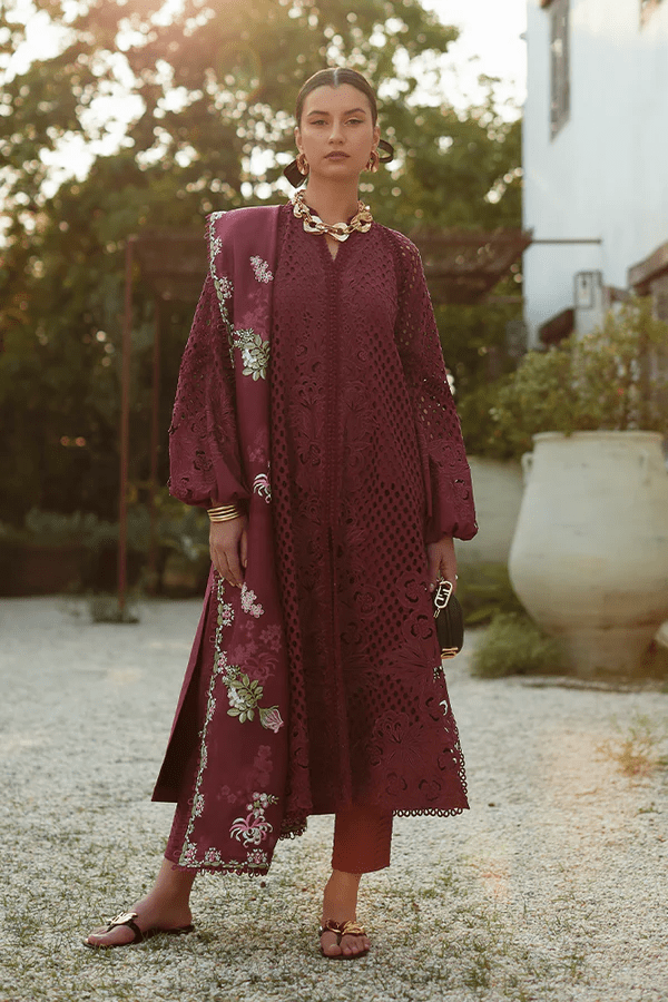 Model wearing a maroon Milan dress from Suffuse's Casual Pret collection, featuring intricate floral embroidery. Perfect for Pakistani clothes online in the UK.