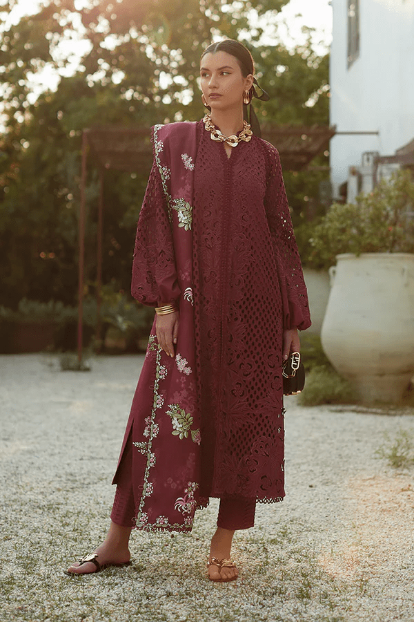 Model wearing a maroon Milan dress from Suffuse's Casual Pret collection, featuring intricate floral embroidery. Perfect for Pakistani clothes online in the UK.