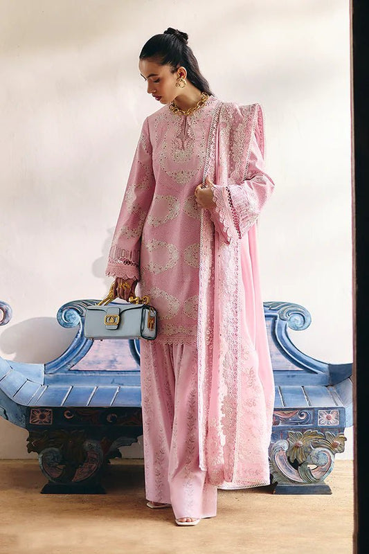 Model wearing a soft candy pink jacquard short shirt with sinuous embroidery and lace - detailed bell sleeves, paired with a wide - bottom floral print shalwar and an embroidered chiffon dupatta with organza borders. Available in the UK, brand Suffuse, Fall Casual Pret '24 collection.