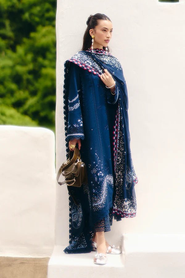 Model wearing a midnight blue jacquard outfit with bell sleeves, lace - trimmed cotton pants, and an embroidered chiffon dupatta from Suffuse Casual Pret '24.