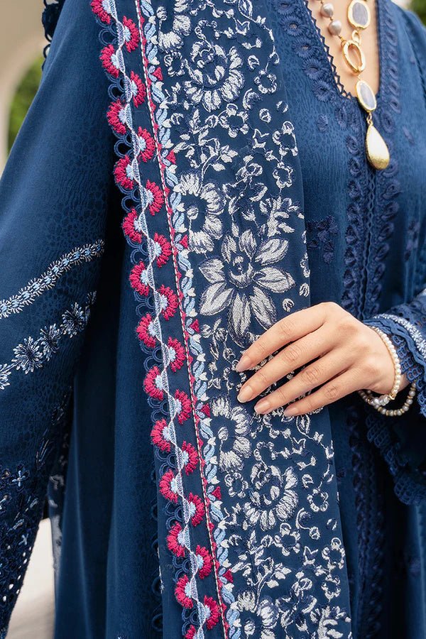 Model wearing a midnight blue jacquard outfit with bell sleeves, lace - trimmed cotton pants, and an embroidered chiffon dupatta from Suffuse Casual Pret '24.