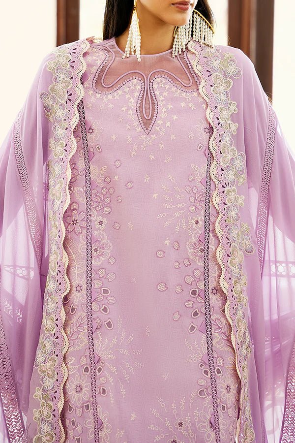 Model is wearing a lilac panelled jacquard shirt with floral embroidery, patchwork, and a crown - shaped organza neckline from Suffuse's Fall Casual Pret '24. Paired with straight cotton pants featuring lace details and cutwork finesse. The chiffon dupatta has organza borders and abstract prints. Available in the UK.