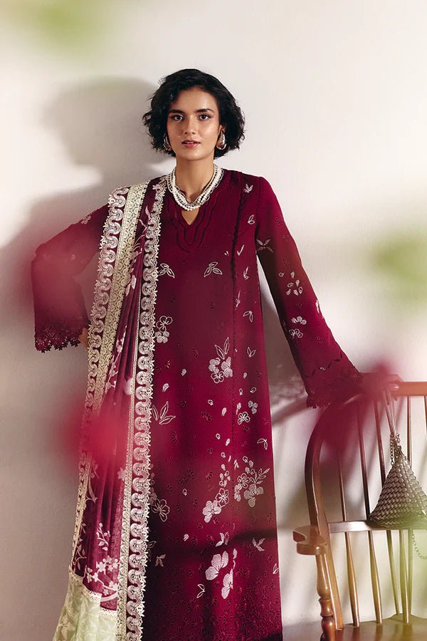 Model wearing Wine red pure cotton jacquard kurta with contrasting embroidery and a layered crew neck. Bell sleeves with lacework. Paired with cotton culottes and a printed silk dupatta with green borders from Suffuse Casual Pret '24.