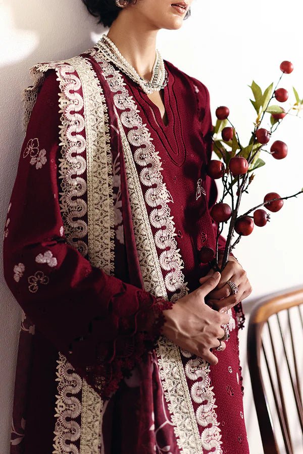 Model wearing Wine red pure cotton jacquard kurta with contrasting embroidery and a layered crew neck. Bell sleeves with lacework. Paired with cotton culottes and a printed silk dupatta with green borders from Suffuse Casual Pret '24.