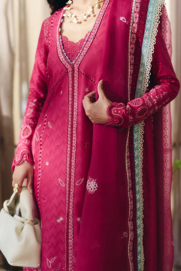 Model wearing a coral pink front open jacquard shirt with intricate lacework, embroidered straight cotton pants, and an organza dupatta featuring ice blue contrasting borders from Suffuse Casual Pret '24.