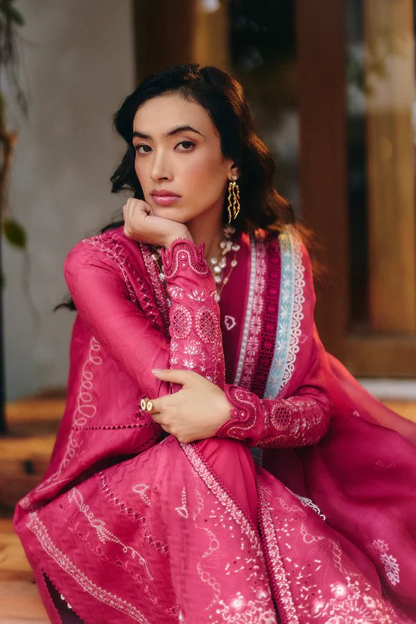 Model wearing a coral pink front open jacquard shirt with intricate lacework, embroidered straight cotton pants, and an organza dupatta featuring ice blue contrasting borders from Suffuse Casual Pret '24.