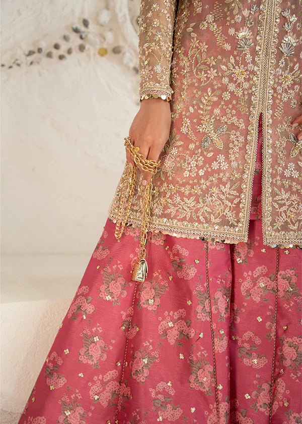 Model wearing pink and gold Hiraeth dress from Suffuse Freeshia RTW 2024 collection. Find Pakistani wedding clothes online in the UK