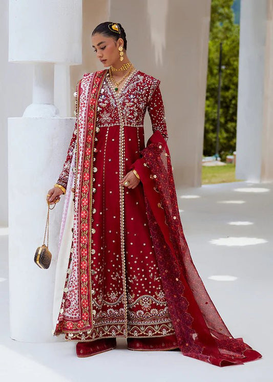 Model wearing a deep red Sahar dress from Suffuse FREESHIA RTW '24, showcasing intricate embroidery. Perfect for wedding clothes, available in the UK.