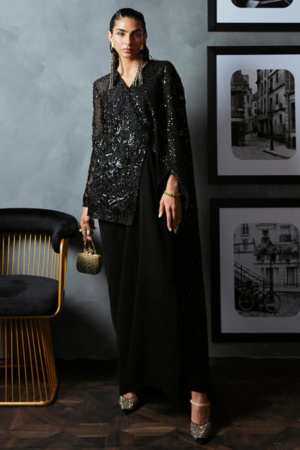 Model wearing Suffuse BELLA black sequined dress, Pakistani luxury pret '24, available in UK.