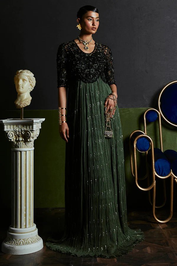 Model wearing Suffuse Freya green pleated gown, Pakistani luxury pret '24 in UK.