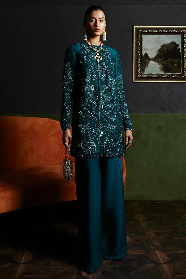 Model in Suffuse JASMINE dress, navy blue with intricate embroidery, Pakistani clothes UK.