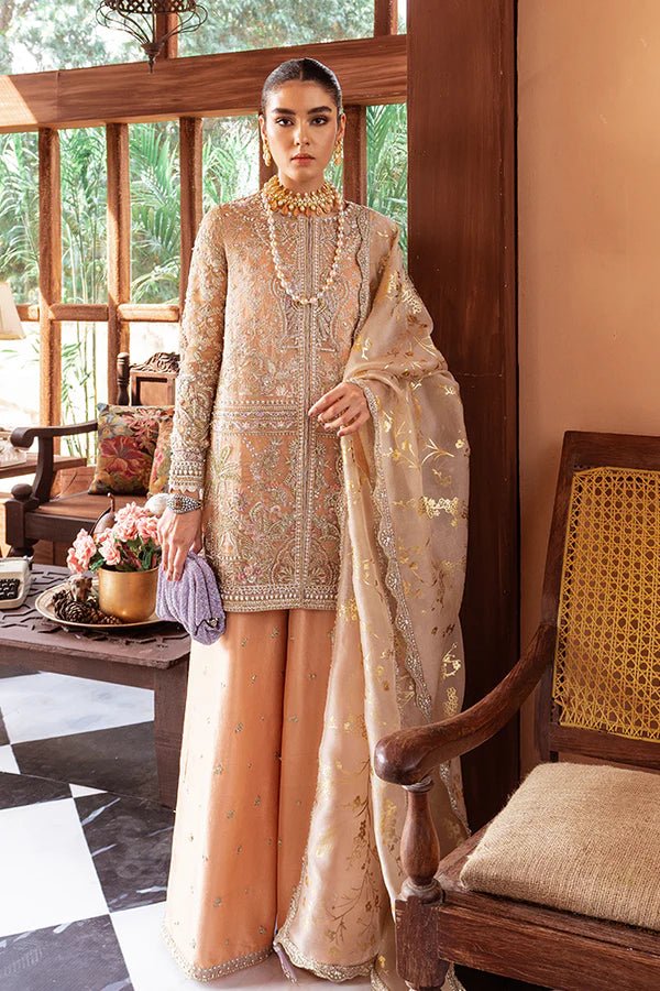 Model in Suffuse UK Marigold luxury pret, Pakistani clothes UK with intricate embroidery.