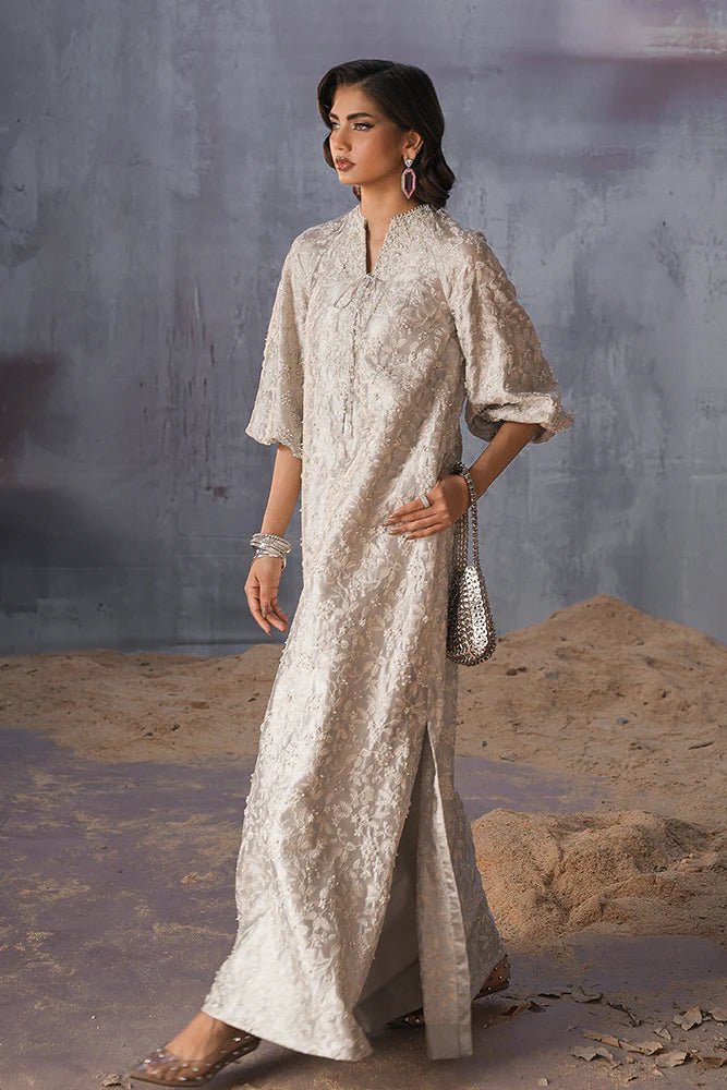 Model wearing Suffuse Silk Pret '24 Ferea dress in soft grey with intricate pearl and thread embroidery. Shop Pakistani bridal dresses online in the UK now.