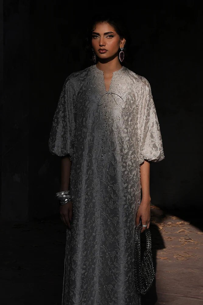 Model wearing Suffuse Silk Pret '24 Ferea dress in soft grey with intricate pearl and thread embroidery. Shop Pakistani bridal dresses online in the UK now.