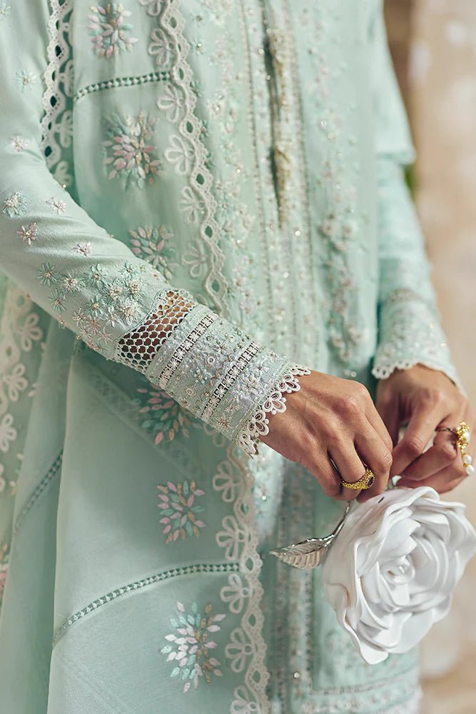 Model wearing Suffuse Silk Pret '24 Gale dress in pastel green with delicate embroidery and embellishments. Shop Pakistani bridal dresses online in the UK now.