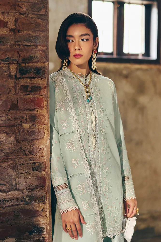 Model wearing Suffuse Silk Pret '24 Gale dress in pastel green with delicate embroidery and embellishments. Shop Pakistani bridal dresses online in the UK now.