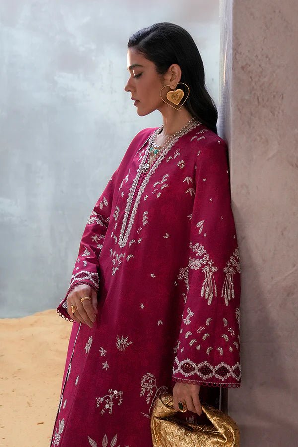 Model wearing a rich magenta Lina dress from Suffuse, perfect for Eid, showcasing elegant Pakistani dress in the UK.