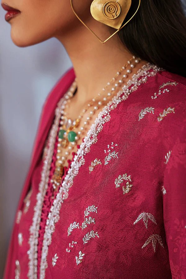 Model wearing a rich magenta Lina dress from Suffuse, perfect for Eid, showcasing elegant Pakistani dress in the UK.