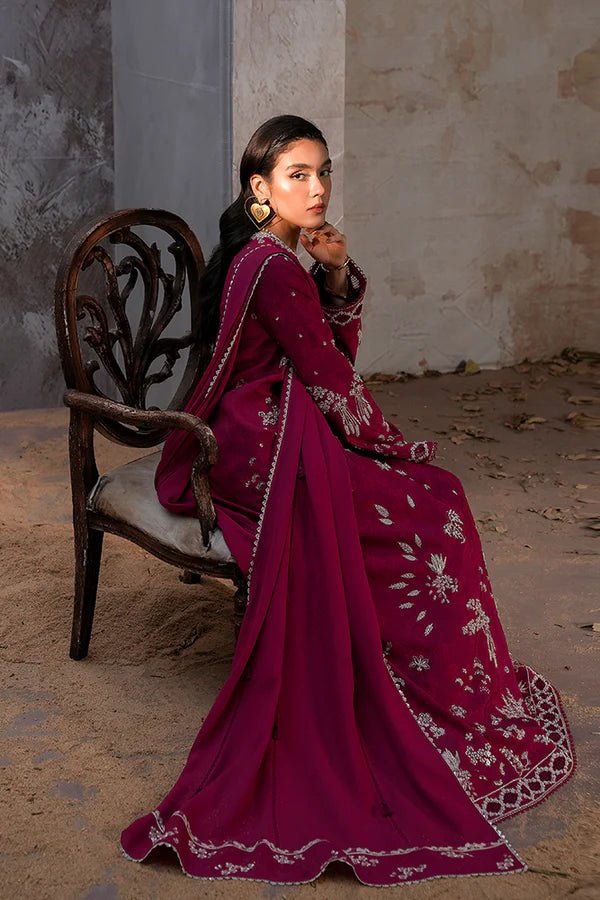 Model wearing a rich magenta Lina dress from Suffuse, perfect for Eid, showcasing elegant Pakistani dress in the UK.