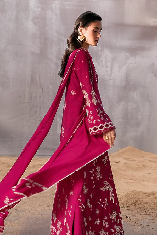 Model wearing a rich magenta Lina dress from Suffuse, perfect for Eid, showcasing elegant Pakistani dress in the UK.