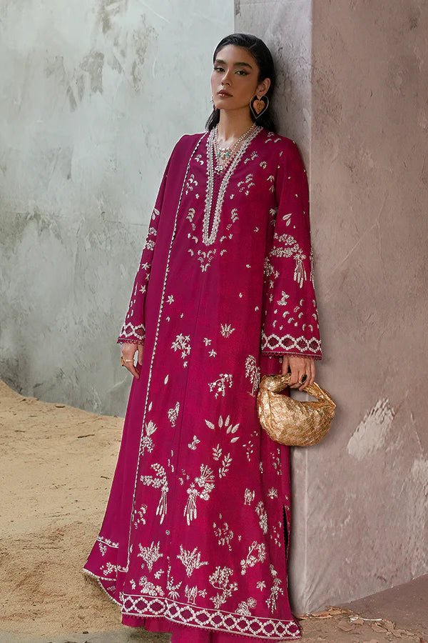 Model wearing a rich magenta Lina dress from Suffuse, perfect for Eid, showcasing elegant Pakistani dress in the UK.