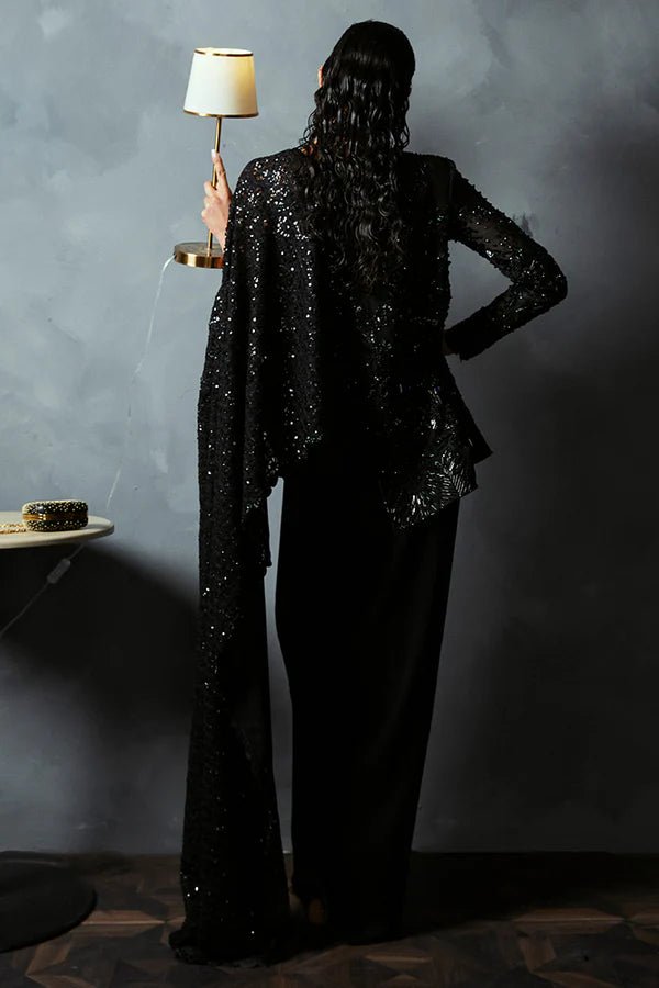 Model wearing Suffuse's BELLA dress, a standout piece from Luxury Pret '24 collection. Pakistani clothes online in UK.