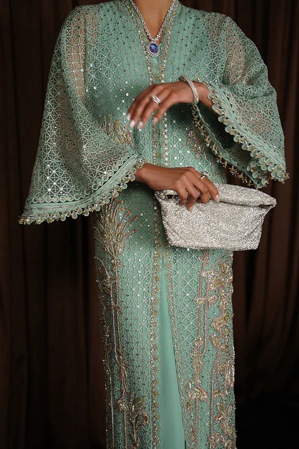 Model wearing Suffuse Luxury Pret '24 LIVIA Aqua Front Open Kaftan. Pakistani clothes online in UK.